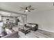 Bright living room with a fireplace, views to the kitchen, and comfortable sofas for relaxing and entertaining at 3743 Southland Dr, Buford, GA 30519