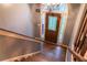 Elegant foyer with stained-glass front door and hardwood staircase at 703 Paul Revere Dr, Locust Grove, GA 30248