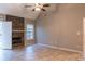 Bright living room featuring vaulted ceilings, fireplace, and neutral walls at 703 Paul Revere Dr, Locust Grove, GA 30248