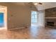 Spacious living room with a fireplace and bright natural light at 703 Paul Revere Dr, Locust Grove, GA 30248