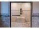 Large tiled shower with built-in bench and niche, featuring decorative tile accents at 703 Paul Revere Dr, Locust Grove, GA 30248