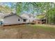 A serene backyard view highlighting a deck and ample green space, perfect for relaxation at 1196 Oak Sw Rd, Lilburn, GA 30047