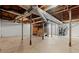 Unfinished basement with exposed pipes and concrete floor, offering potential for customization at 1196 Oak Sw Rd, Lilburn, GA 30047