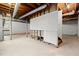 Unfinished basement featuring exposed ceiling and concrete floor, offering potential for customization at 1196 Oak Sw Rd, Lilburn, GA 30047