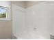 Bright bathroom features a tiled shower and a window for natural light at 1196 Oak Sw Rd, Lilburn, GA 30047