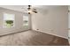 Bedroom with natural light, ceiling fan, and neutral carpeting at 1196 Oak Sw Rd, Lilburn, GA 30047