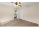 Bedroom featuring neutral carpet, a ceiling fan, and a closet for storage at 1196 Oak Sw Rd, Lilburn, GA 30047