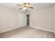 Bedroom featuring neutral carpet, a ceiling fan, and a closet for storage at 1196 Oak Sw Rd, Lilburn, GA 30047