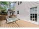 Charming deck with a table and chairs, ideal for relaxing and enjoying the outdoors at 1196 Oak Sw Rd, Lilburn, GA 30047