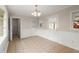 Dining area featuring neutral decor, tile floors, and abundant natural light from the windows at 1196 Oak Sw Rd, Lilburn, GA 30047