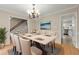 Dining room showcasing an elegant table setting and access to other living spaces at 1196 Oak Sw Rd, Lilburn, GA 30047