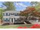 Inviting two-story home with attached garage, manicured lawn, and mature trees at 1196 Oak Sw Rd, Lilburn, GA 30047