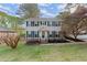 Inviting two-story home with a well-manicured lawn and blossoming landscape at 1196 Oak Sw Rd, Lilburn, GA 30047