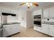 Bright kitchen features white cabinets, granite countertops, and stainless steel appliances at 1196 Oak Sw Rd, Lilburn, GA 30047