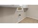 Functional laundry room area with connections and tile flooring at 1196 Oak Sw Rd, Lilburn, GA 30047