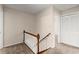 Carpeted staircase with white banister leading to the upper level at 1196 Oak Sw Rd, Lilburn, GA 30047