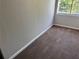 A bright bedroom features neutral paint and wall-to-wall carpeting at 3260 Rivermist Cv, Decatur, GA 30034