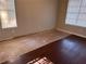 Bedroom featuring two windows and updated hardwood flooring at 3260 Rivermist Cv, Decatur, GA 30034