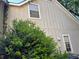 Exterior view of a home with light siding and mature landscaping at 3260 Rivermist Cv, Decatur, GA 30034