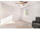 Comfortable bedroom with plush carpeting, a ceiling fan, and natural light at 345 Caledonia Ct, Peachtree City, GA 30269
