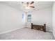 This bedroom features neutral carpet, walls, trim and a modern ceiling fan at 345 Caledonia Ct, Peachtree City, GA 30269