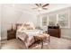 Inviting main bedroom features a decorative canopy, plush carpeting, and two windows at 345 Caledonia Ct, Peachtree City, GA 30269