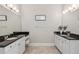 Stylish bathroom with double vanity, granite counters, and tile flooring at 5705 Windjammer Pt, Cumming, GA 30041