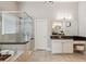 Bright bathroom featuring glass enclosed shower, tub, tile floor, and double sink at 5705 Windjammer Pt, Cumming, GA 30041