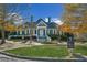 The Bay Club clubhouse with manicured lawn and lush landscaping at 5705 Windjammer Pt, Cumming, GA 30041