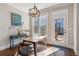 Charming breakfast nook with modern lighting fixture and backyard access at 5705 Windjammer Pt, Cumming, GA 30041