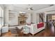 Spacious living room with stone fireplace, built in shelving and convenient access to dining room at 5705 Windjammer Pt, Cumming, GA 30041