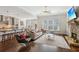 Open-concept living room with stone fireplace, eat in kitchen, and great natural light at 5705 Windjammer Pt, Cumming, GA 30041
