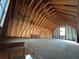 Unfinished attic space featuring exposed wooden beams and rafters ready to be personalized and finished at 5834 Heardsville Rd, Cumming, GA 30028