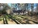 Charming home with a welcoming front porch, set amidst a spacious yard shaded by mature trees at 5834 Heardsville Rd, Cumming, GA 30028