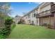 Beautiful backyard with lush green lawn and manicured landscaping at 611 Vinings Estates Se Dr, Smyrna, GA 30126