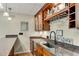 Close-up of a bar countertop and cabinets for storing drinks and glasses at 611 Vinings Estates Se Dr, Smyrna, GA 30126
