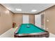 Finished basement boasts a pool table and neutral carpet at 611 Vinings Estates Se Dr, Smyrna, GA 30126