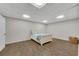 Finished basement area featuring luxury vinyl flooring and a bed at 611 Vinings Estates Se Dr, Smyrna, GA 30126