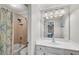 Bathroom featuring a shower-tub combo and vanity with sink at 611 Vinings Estates Se Dr, Smyrna, GA 30126