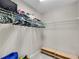Walk-in closet with racks and shelves for organizing clothes and accessories at 611 Vinings Estates Se Dr, Smyrna, GA 30126