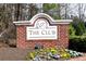 Beautifully maintained neighborhood entrance with brick sign at 611 Vinings Estates Se Dr, Smyrna, GA 30126