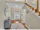 Spacious foyer with hardwood floors, staircase, and a view of the front door at 611 Vinings Estates Se Dr, Smyrna, GA 30126
