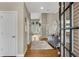 Inviting foyer with hardwood floors, a stylish rug, and a view into the naturally lit living spaces at 611 Vinings Estates Se Dr, Smyrna, GA 30126