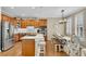 Gourmet kitchen featuring stainless steel appliances, granite countertops, and a dining area with natural light at 611 Vinings Estates Se Dr, Smyrna, GA 30126