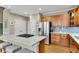 Spacious kitchen boasts stainless appliances, custom cabinetry, granite counters, and gas cooktop at 611 Vinings Estates Se Dr, Smyrna, GA 30126