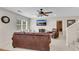 Living room with leather sofas, a window, and a ceiling fan at 611 Vinings Estates Se Dr, Smyrna, GA 30126