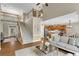 Open-concept living area with staircase, hardwood floors, and a view into the well-appointed kitchen at 611 Vinings Estates Se Dr, Smyrna, GA 30126