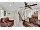 Cozy living room featuring leather sofas and a staircase at 611 Vinings Estates Se Dr, Smyrna, GA 30126