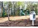 Community playground with slides, swings, and a small book exchange at 611 Vinings Estates Se Dr, Smyrna, GA 30126