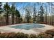 Community pool is covered and surrounded by a fence and trees at 611 Vinings Estates Se Dr, Smyrna, GA 30126